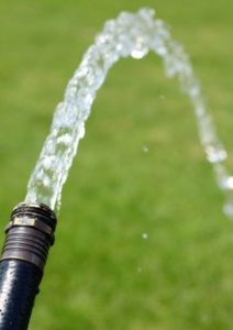water coming out of a water hose- current and voltage