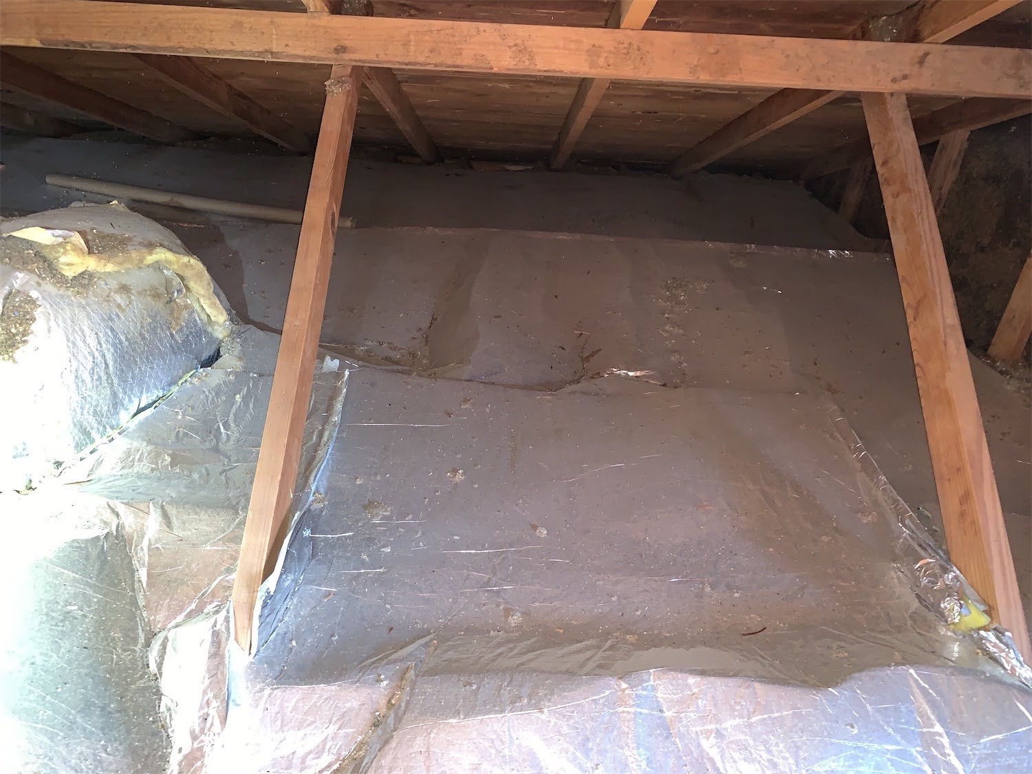 Radiant barrier laid on top of the insulation on the attic floor